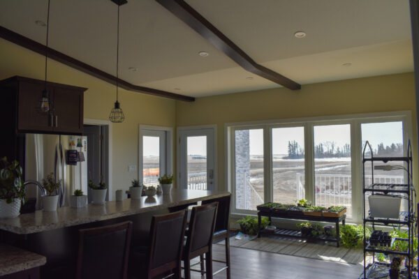 Kitchen and view: Little Home on the Prairies, a forever home in Saskatchewan Canada 